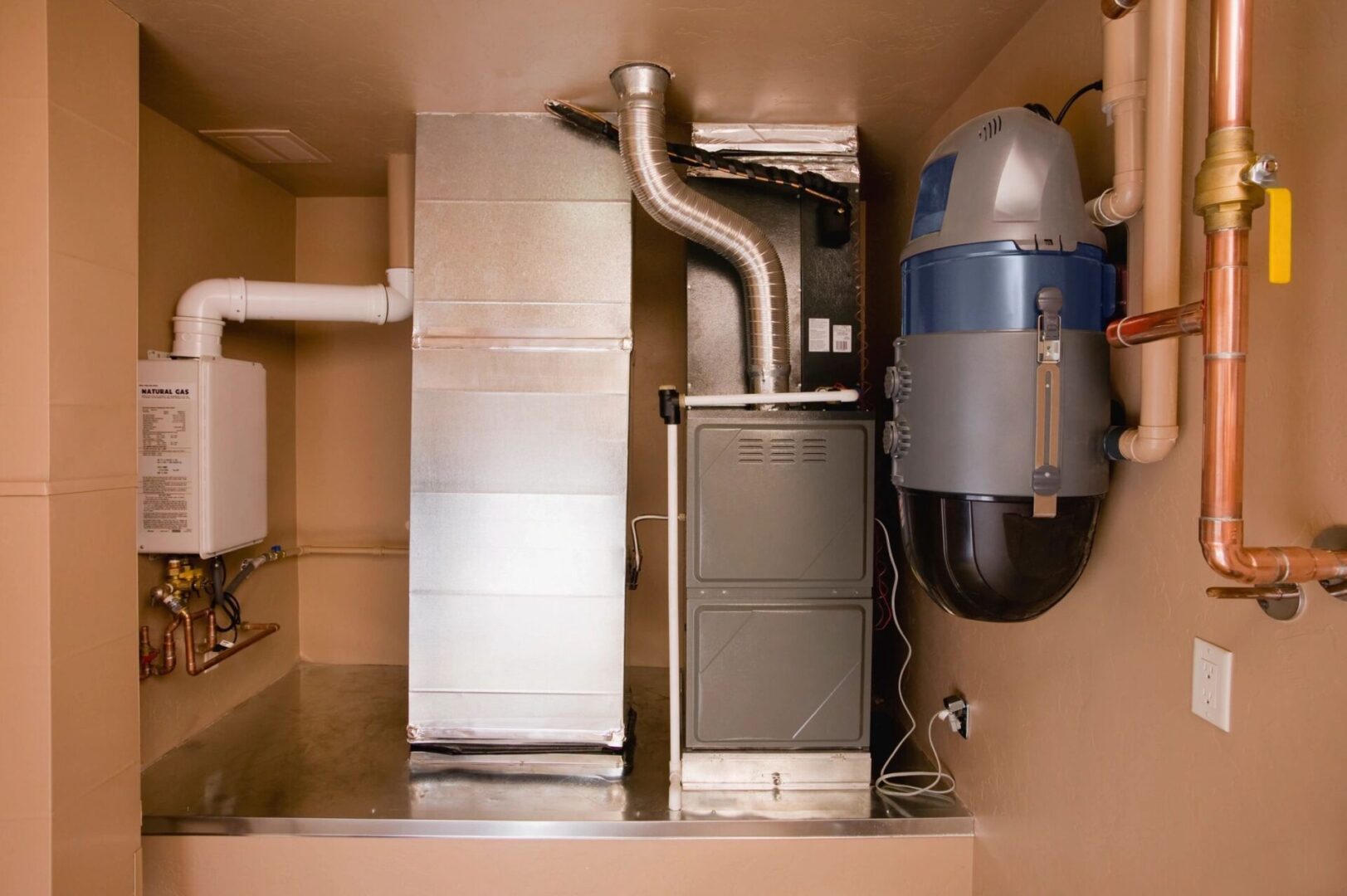 A gas furnace and air conditioner in a room.